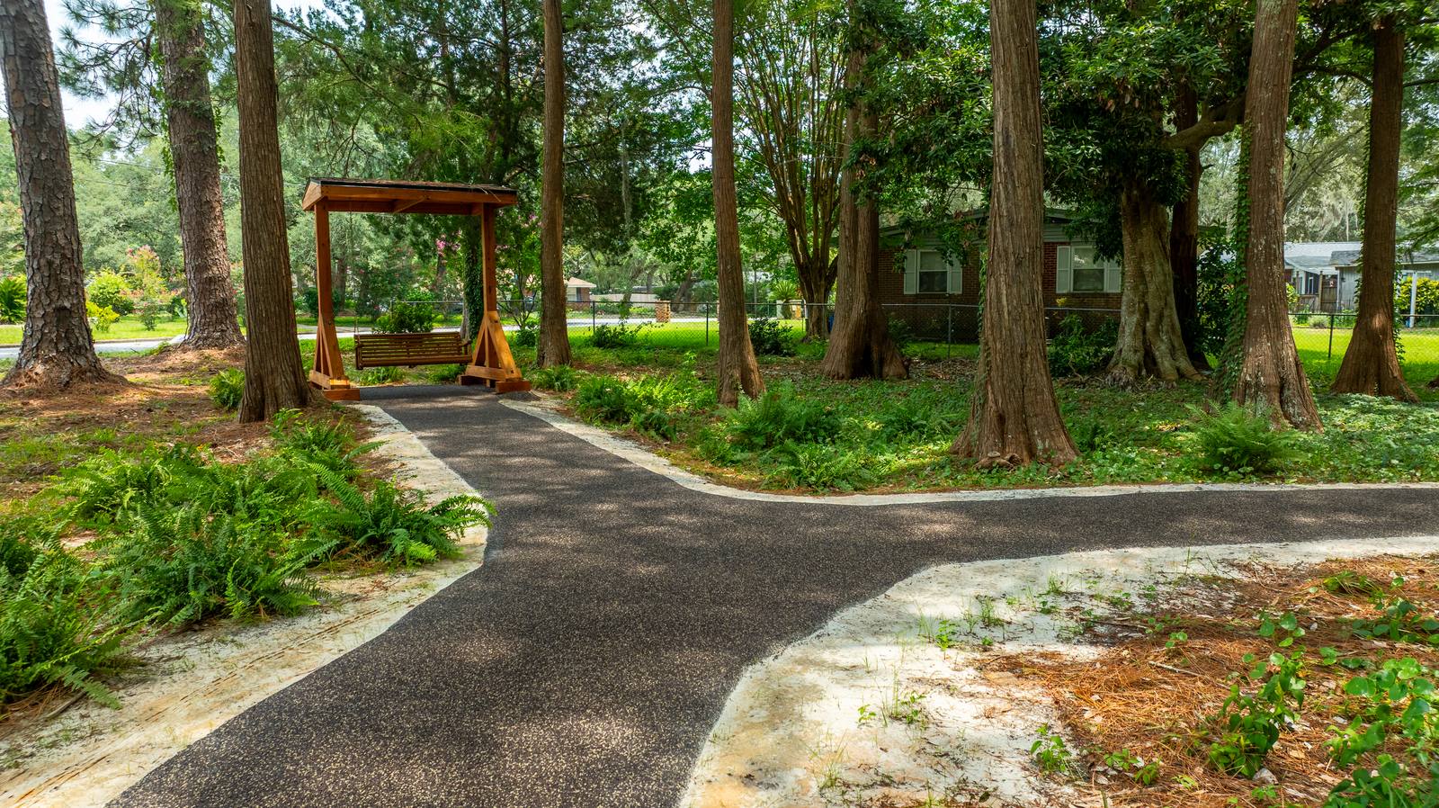 Flexus AP-200 installed — trail leading to seating swing, Azalea Park